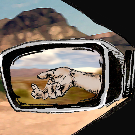 hand in a sideview mirror